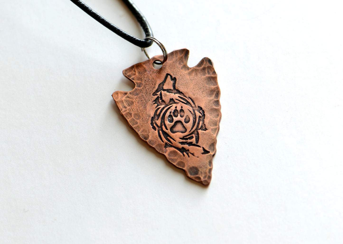 Arrowhead copper necklace  with howling wolf and paw