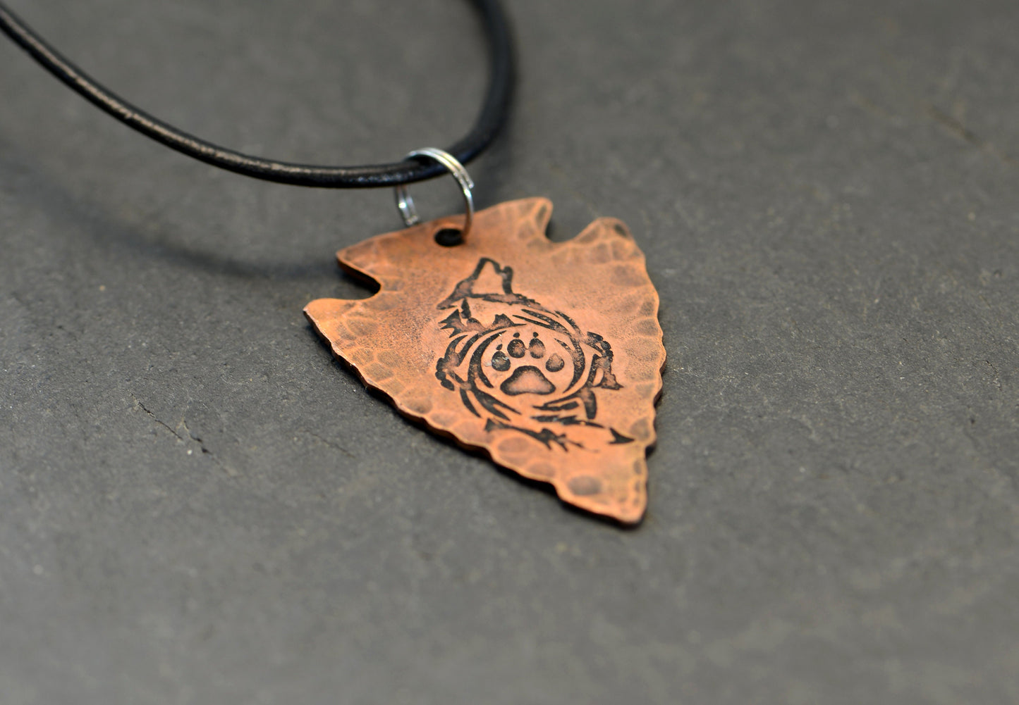 Arrowhead copper necklace  with howling wolf and paw