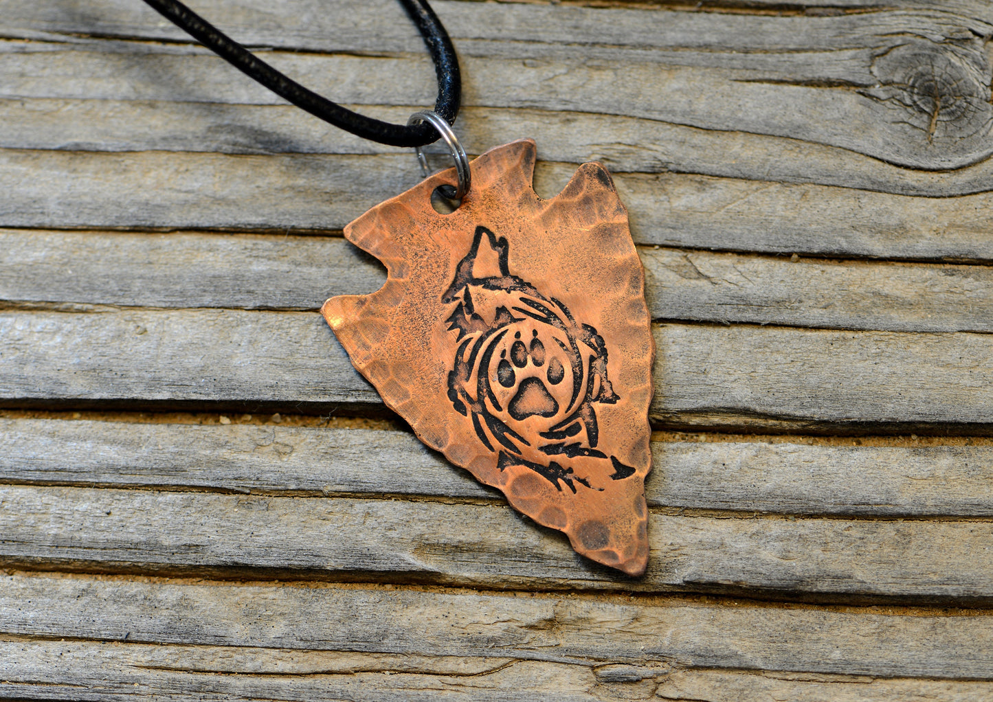 Arrowhead copper necklace  with howling wolf and paw