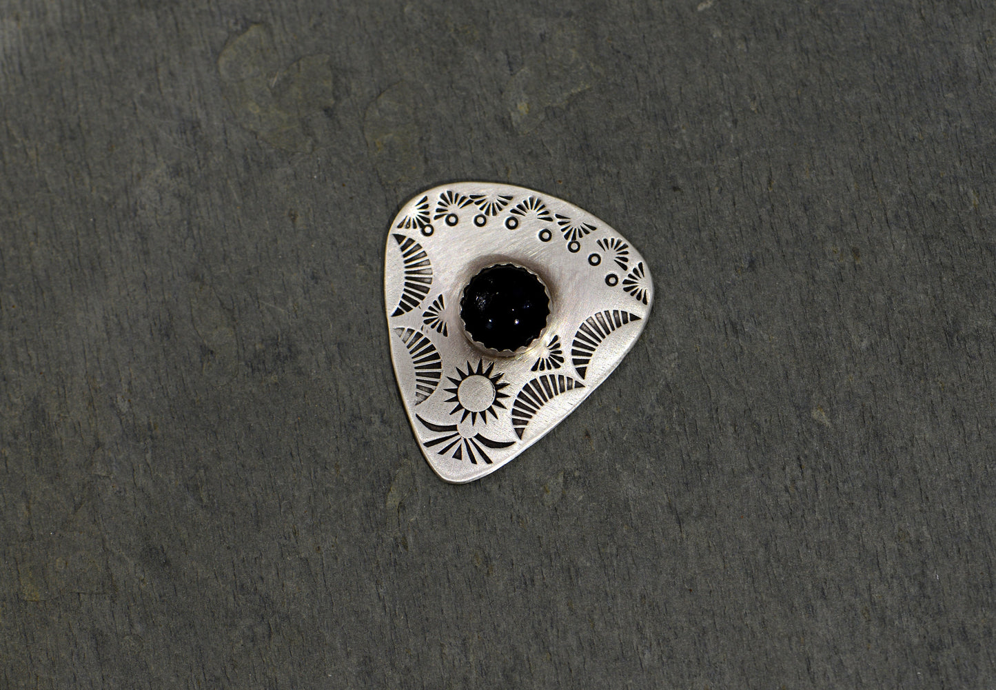 Guitar pick with Onyx on sterling silver