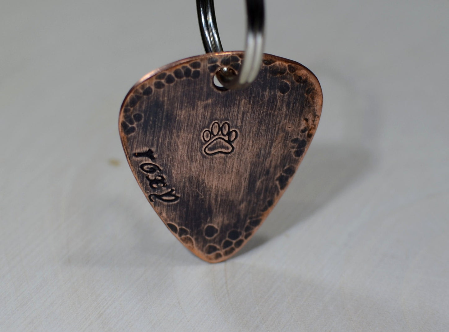 Guitar pick dog tag with rustic hammered finish