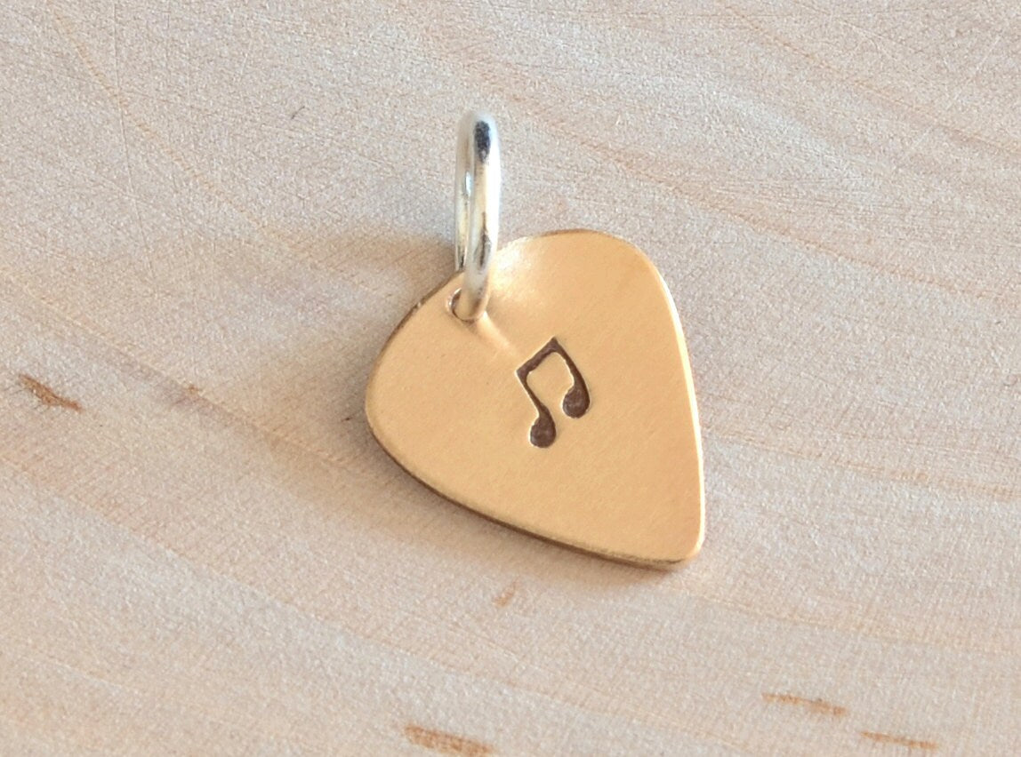 Tiny bronze guitar pick charm