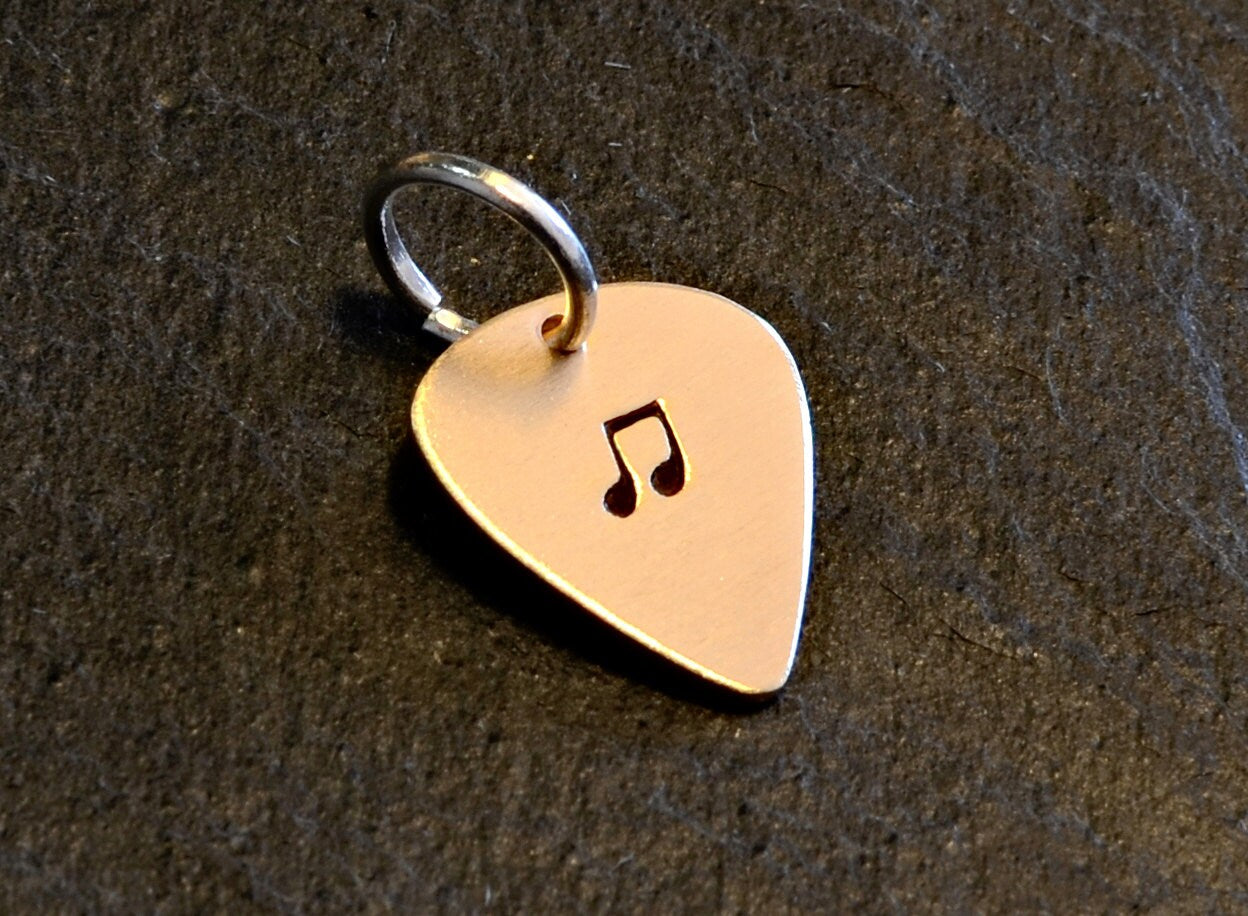 Tiny bronze guitar pick charm