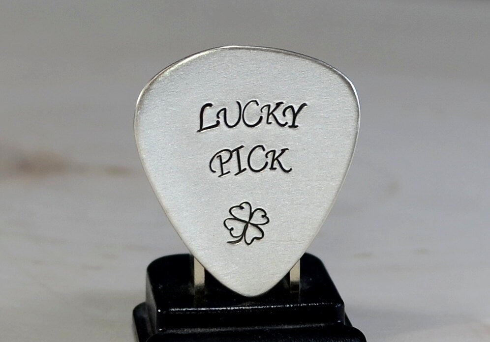 Sterling silver lucky guitar pick with four leaf clover