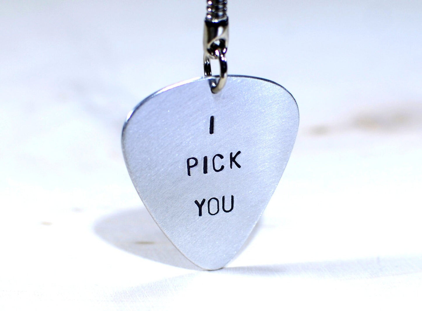 Sterling silver guitar pick key chain with I pick you