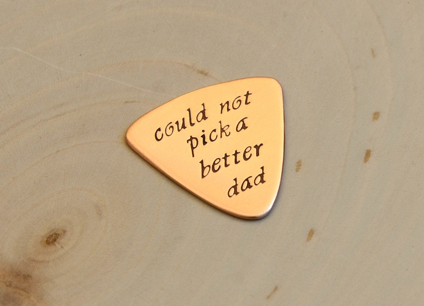 Copper Triangular Guitar Pick stamped with Couldn't Pick a Better Dad
