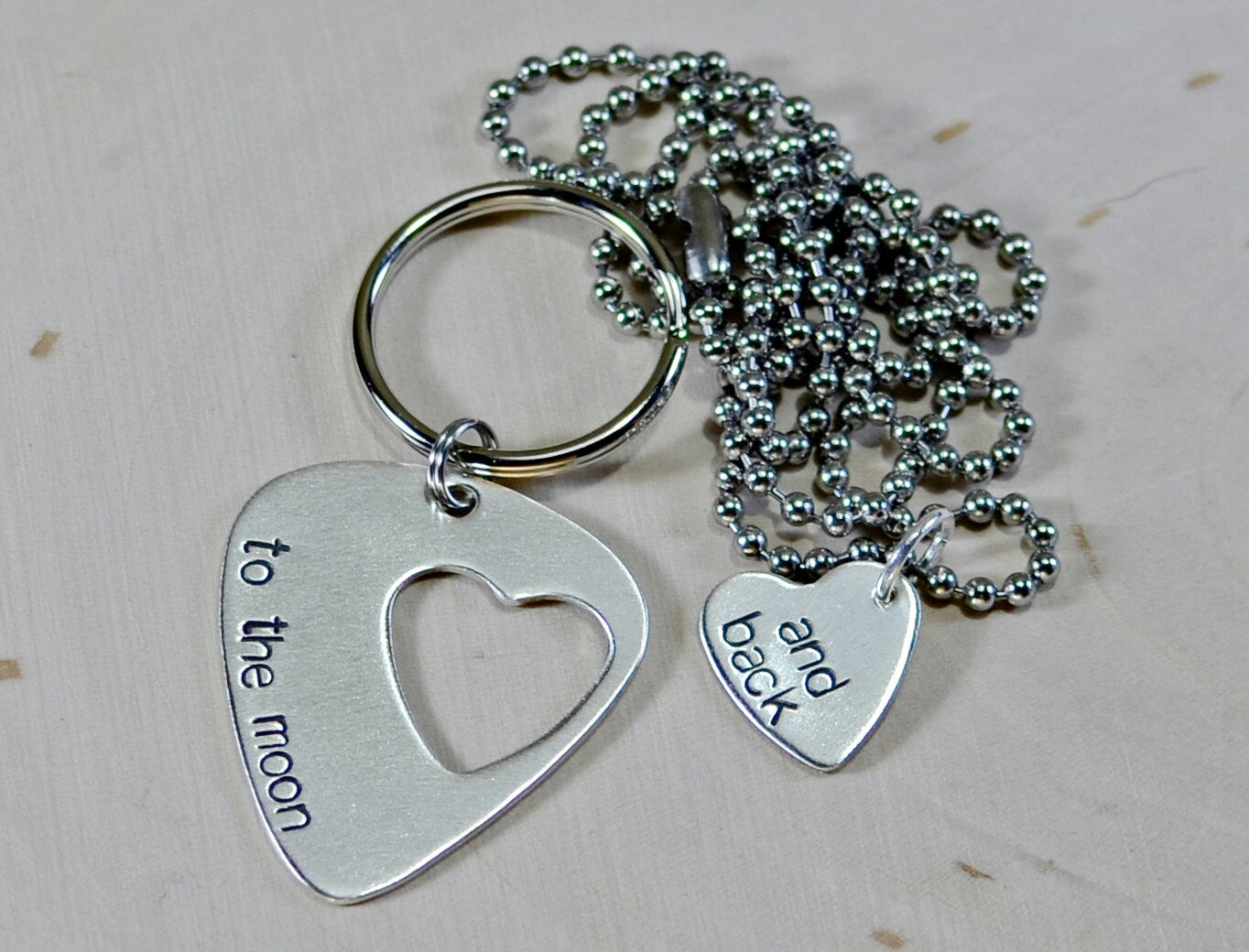 Couples sterling silver guitar pick keychain and necklace with love to the moon and back