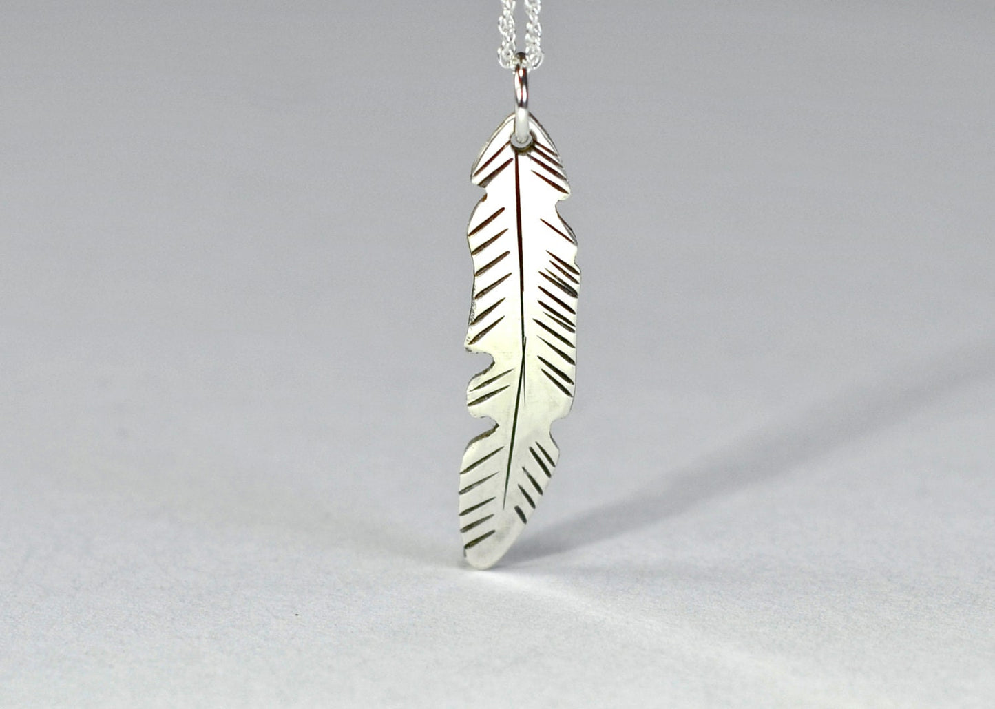 Dainty small sterling silver feather necklace