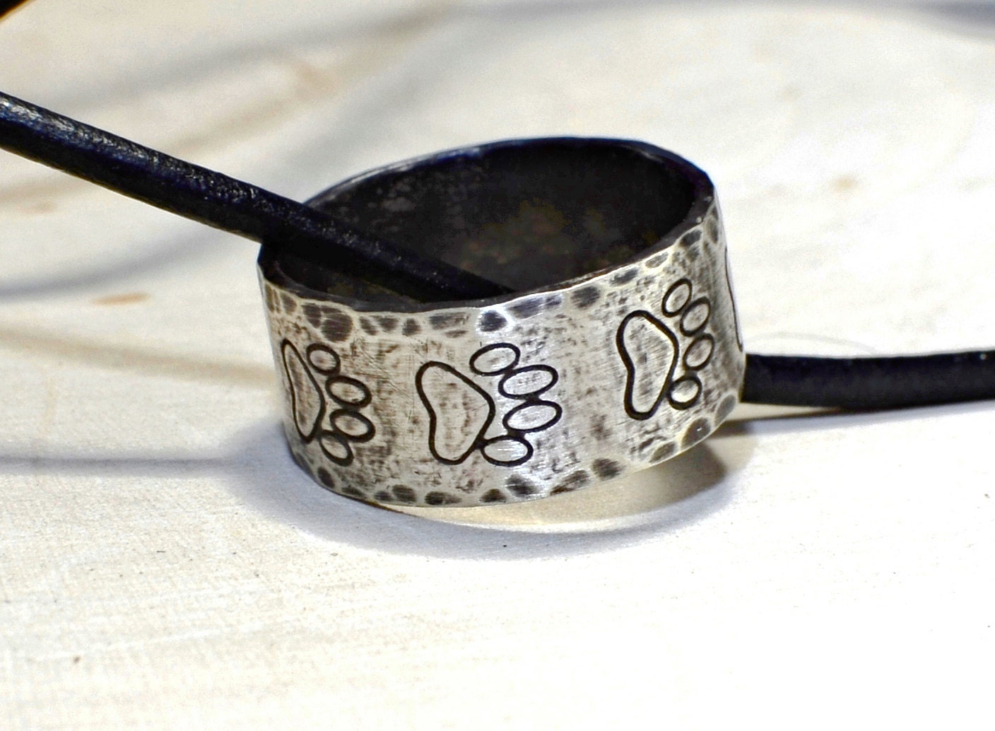 Hammered sterling silver paw ring necklace with rustic dark patina