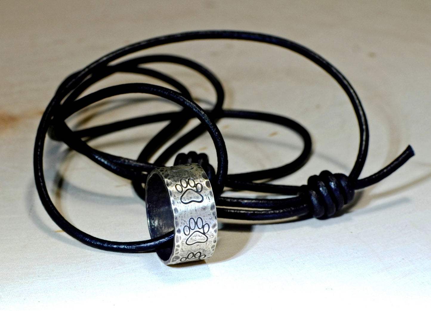 Hammered sterling silver paw ring necklace with rustic dark patina
