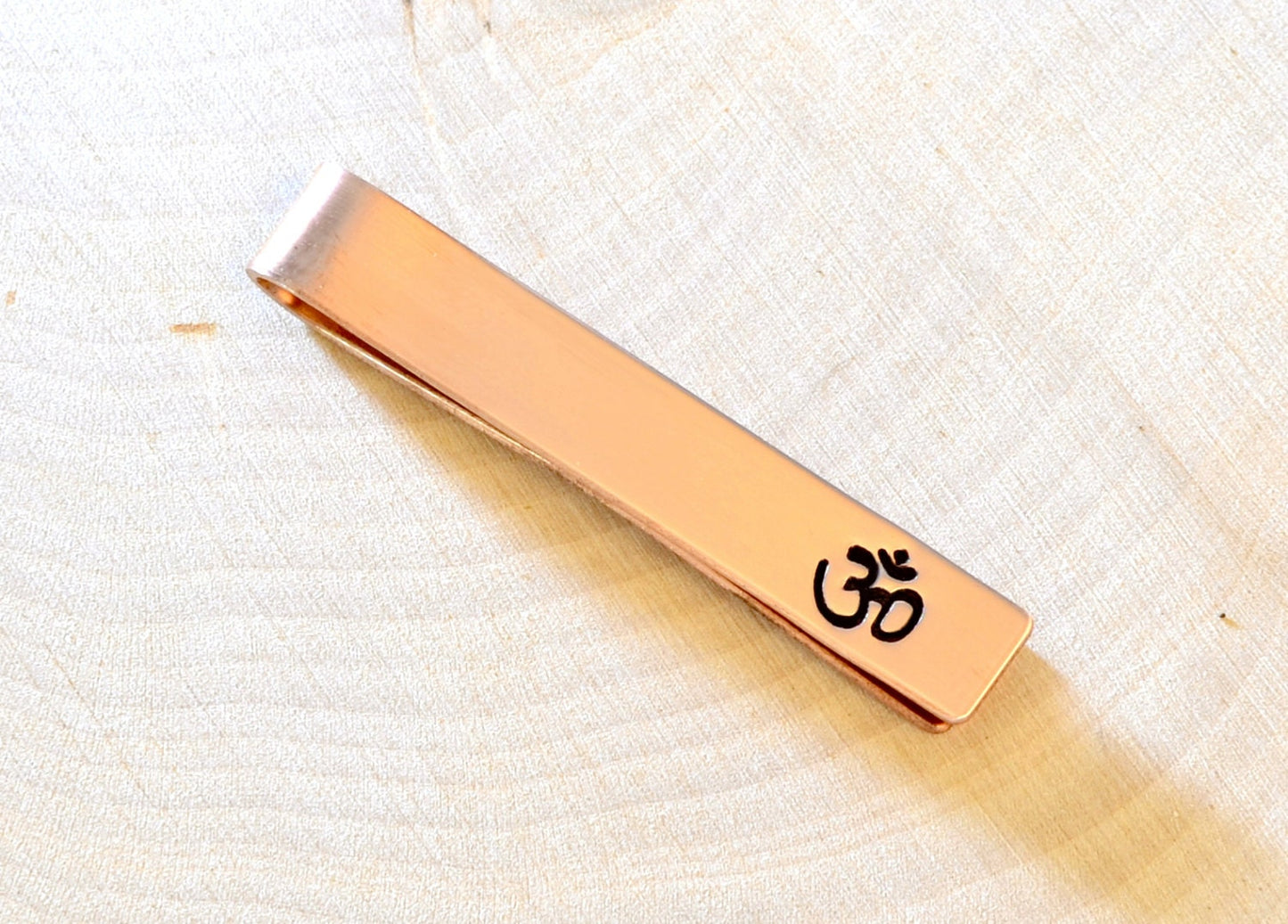 Yoga themed copper tie clip with Aum
