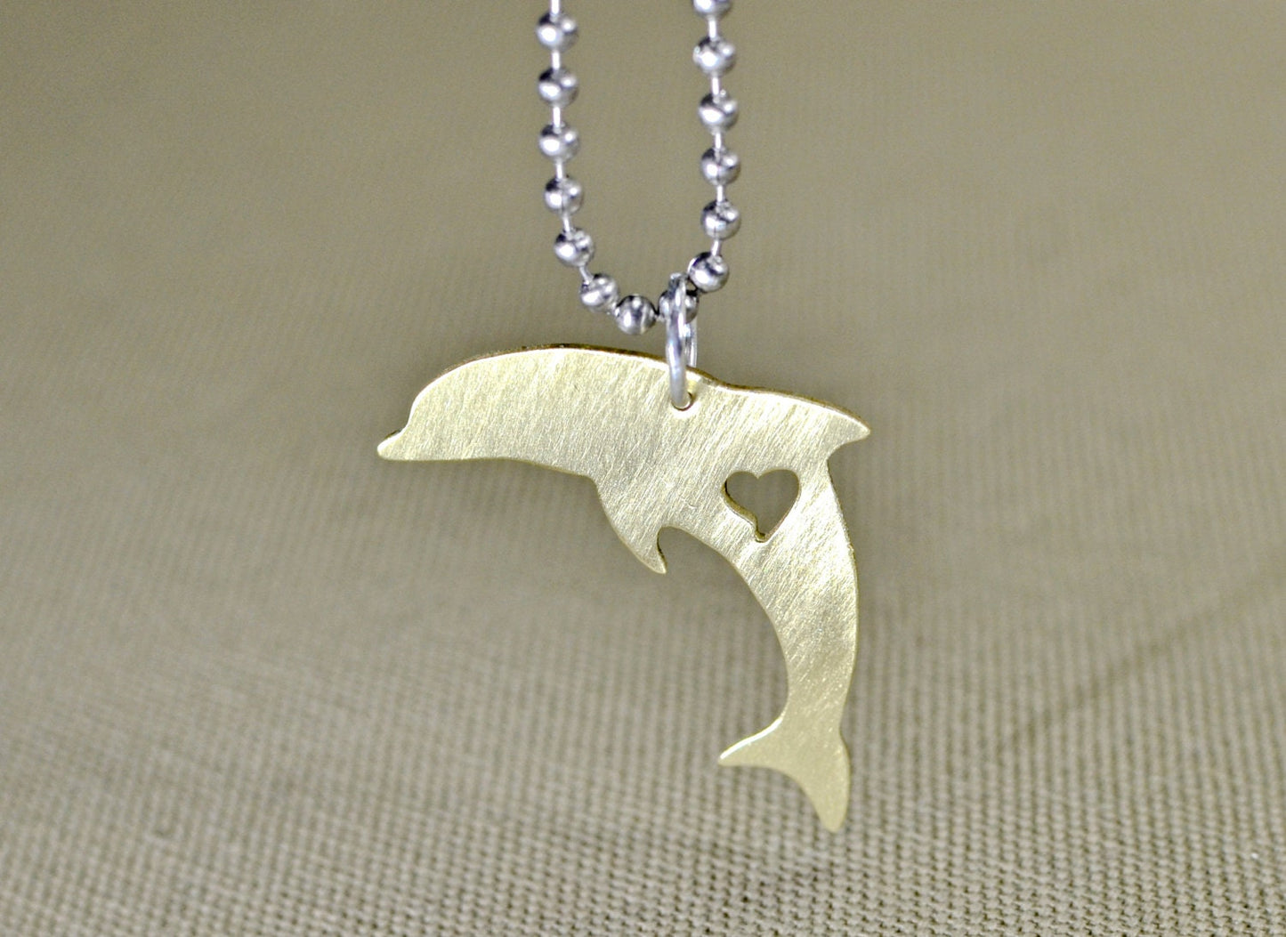 Dolphin necklace in various metals