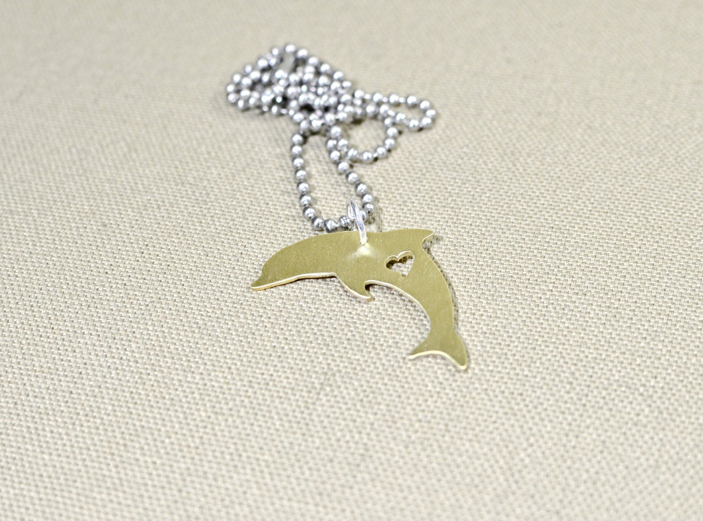Dolphin necklace in various metals