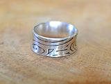 Sterling silver anticlastic ring handmade with swirling pattern, NiciArt 