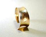 Hammered bronze cuff bracelet with anticlastic form and tapered curve, NiciArt 