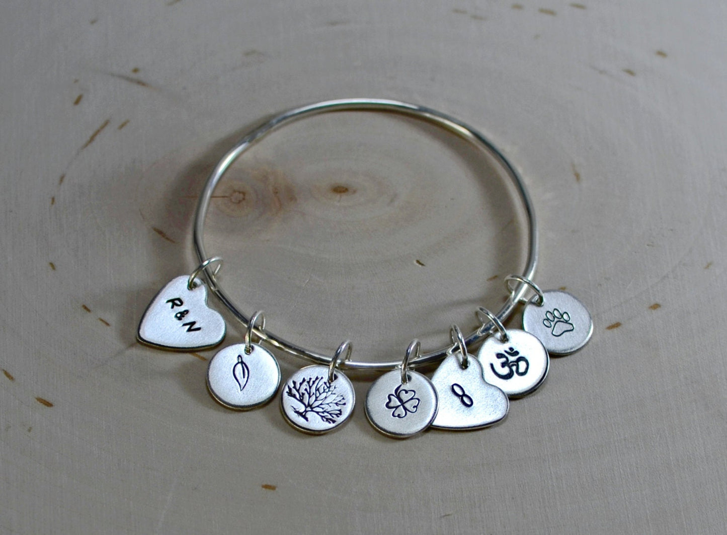 Sterling Silver Bangle in Triangular Shape with Custom Stamped Charms
