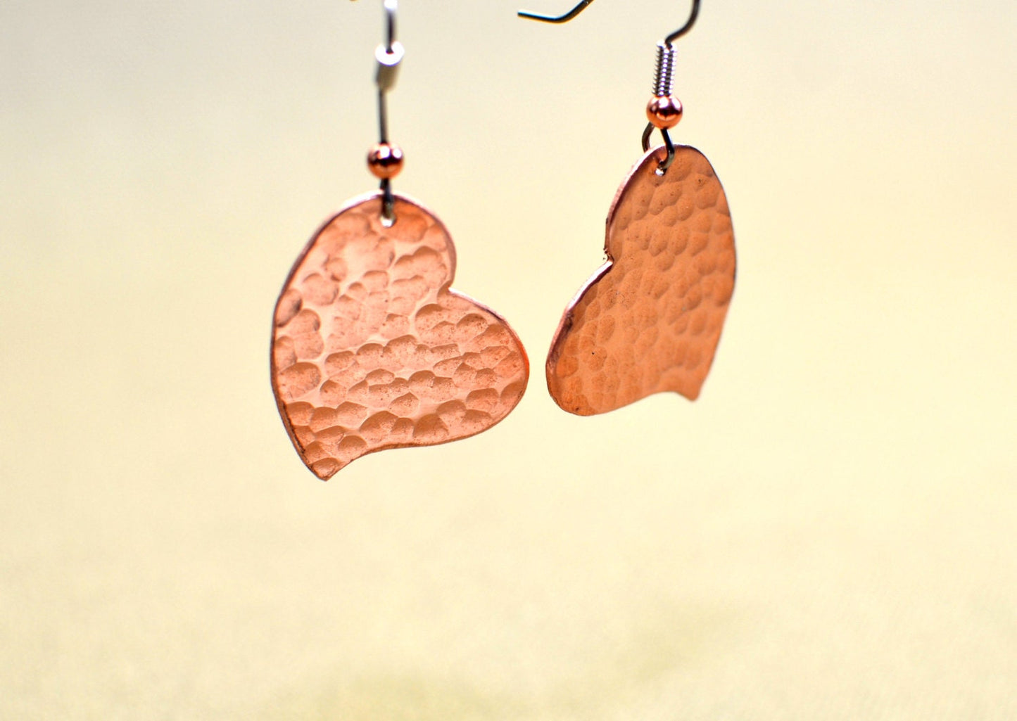 Hammered copper hearts handcrafted as unique dangle earrings