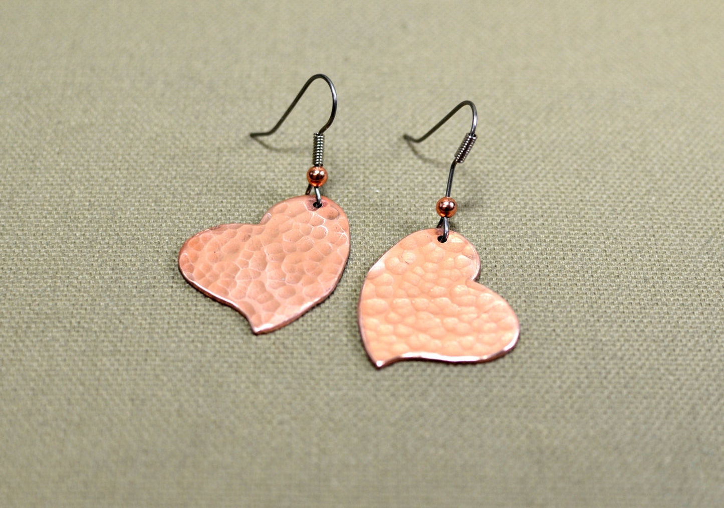 Hammered copper hearts handcrafted as unique dangle earrings