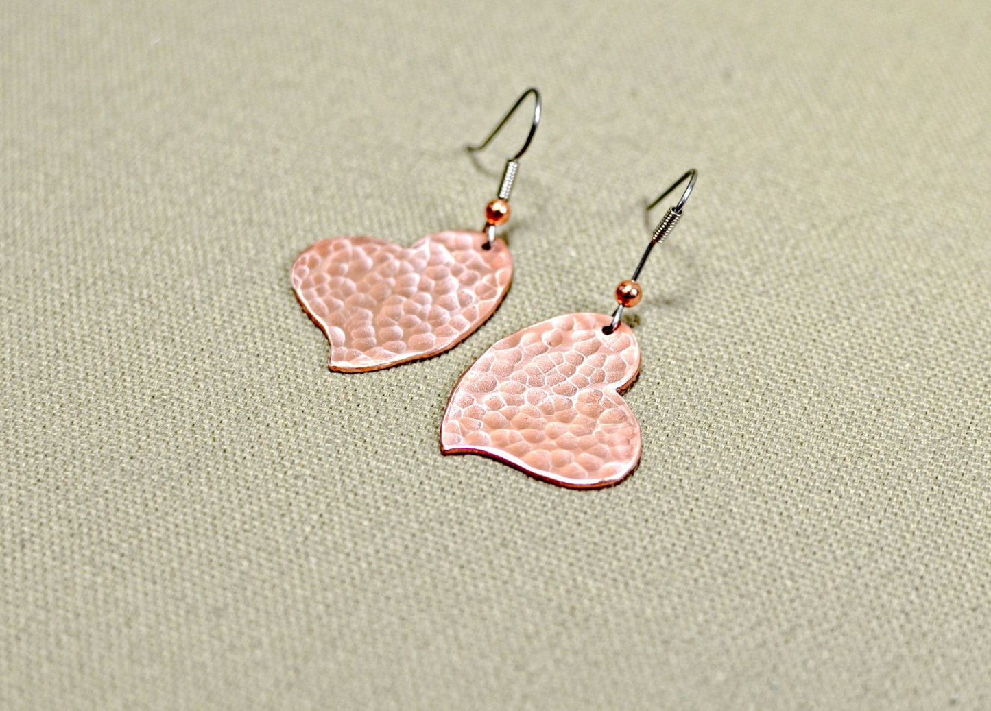 Hammered copper hearts handcrafted as unique dangle earrings