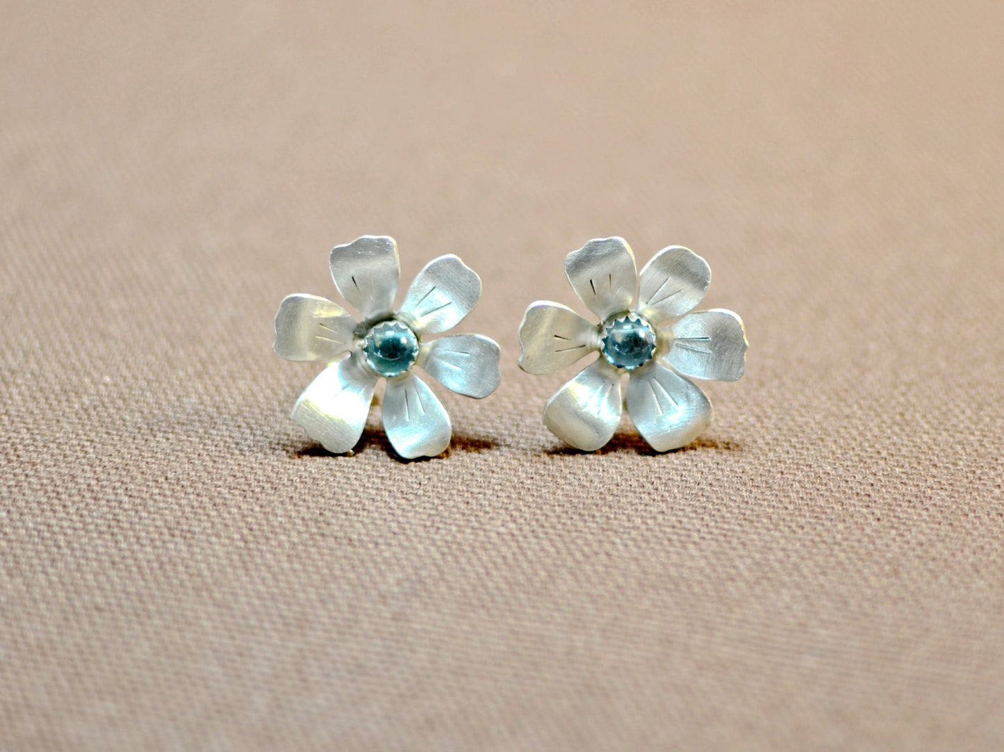 Sterling silver handcrafted flower earrings with blue topaz