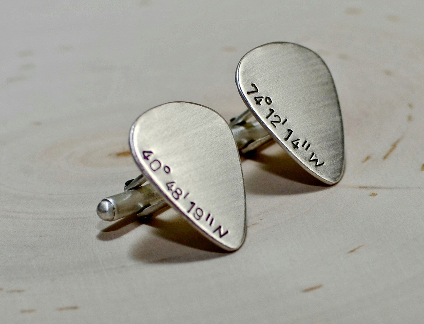 Sterling silver guitar pick cuff links with personalized latitude and longitude coordinates