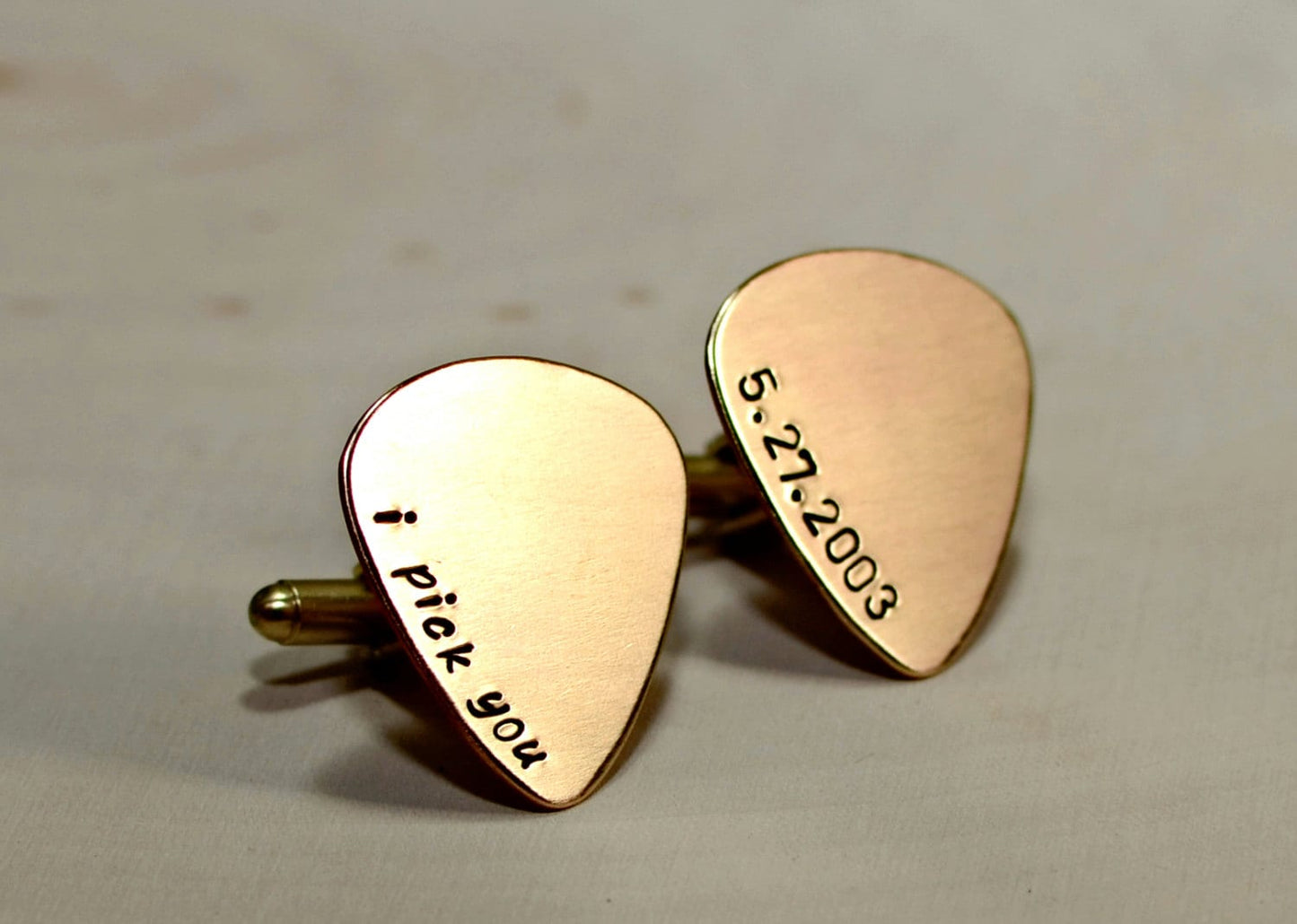 Bronze guitar pick cuff links engraved with I Pick You and wedding date