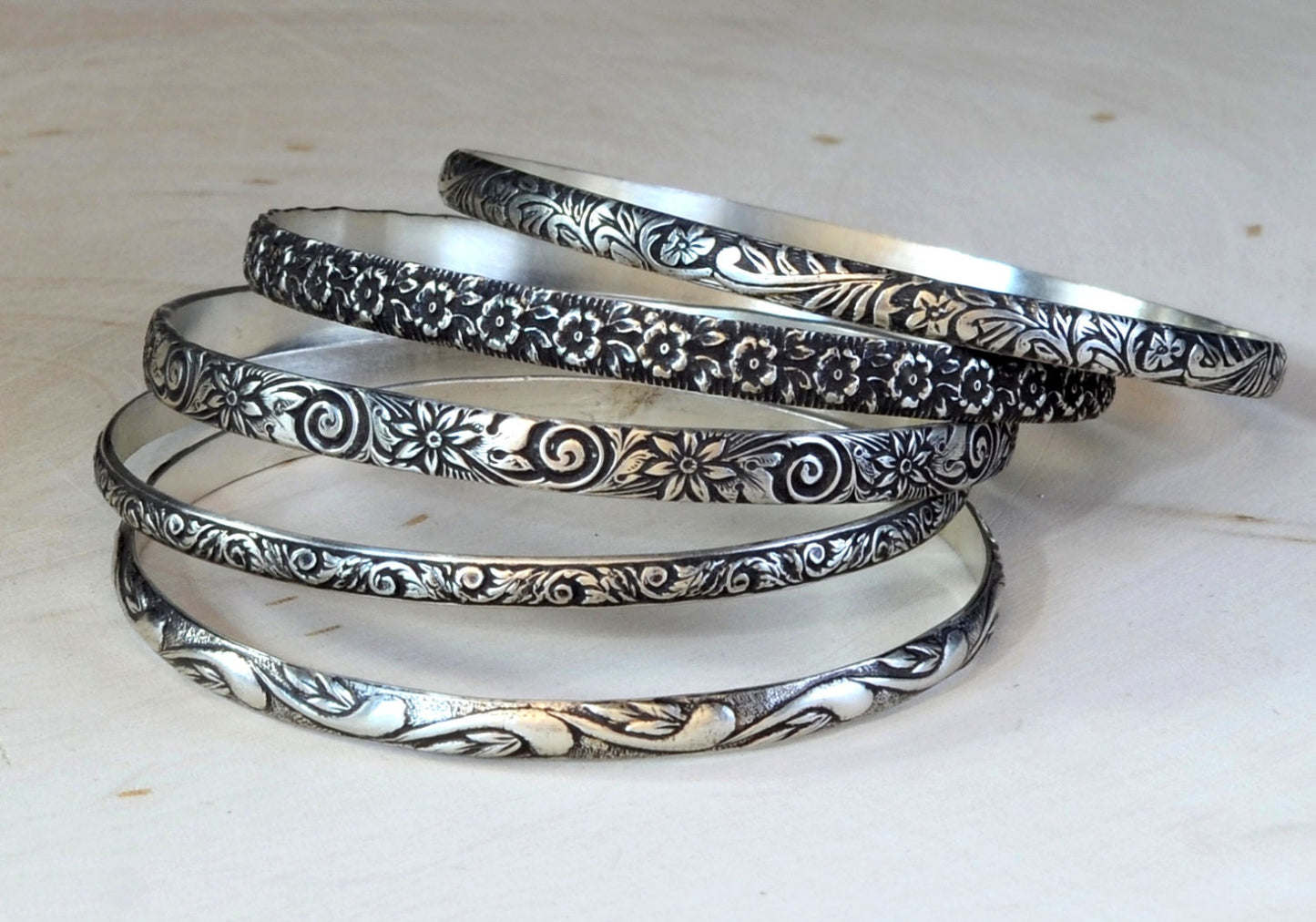 Sterling Silver Stacking Bangle Set with various Floral themes and patinas