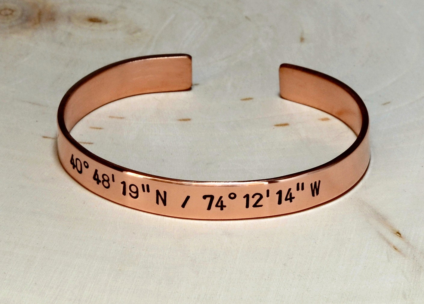 Personalized latitude longitude coordinates on copper cuff bracelet